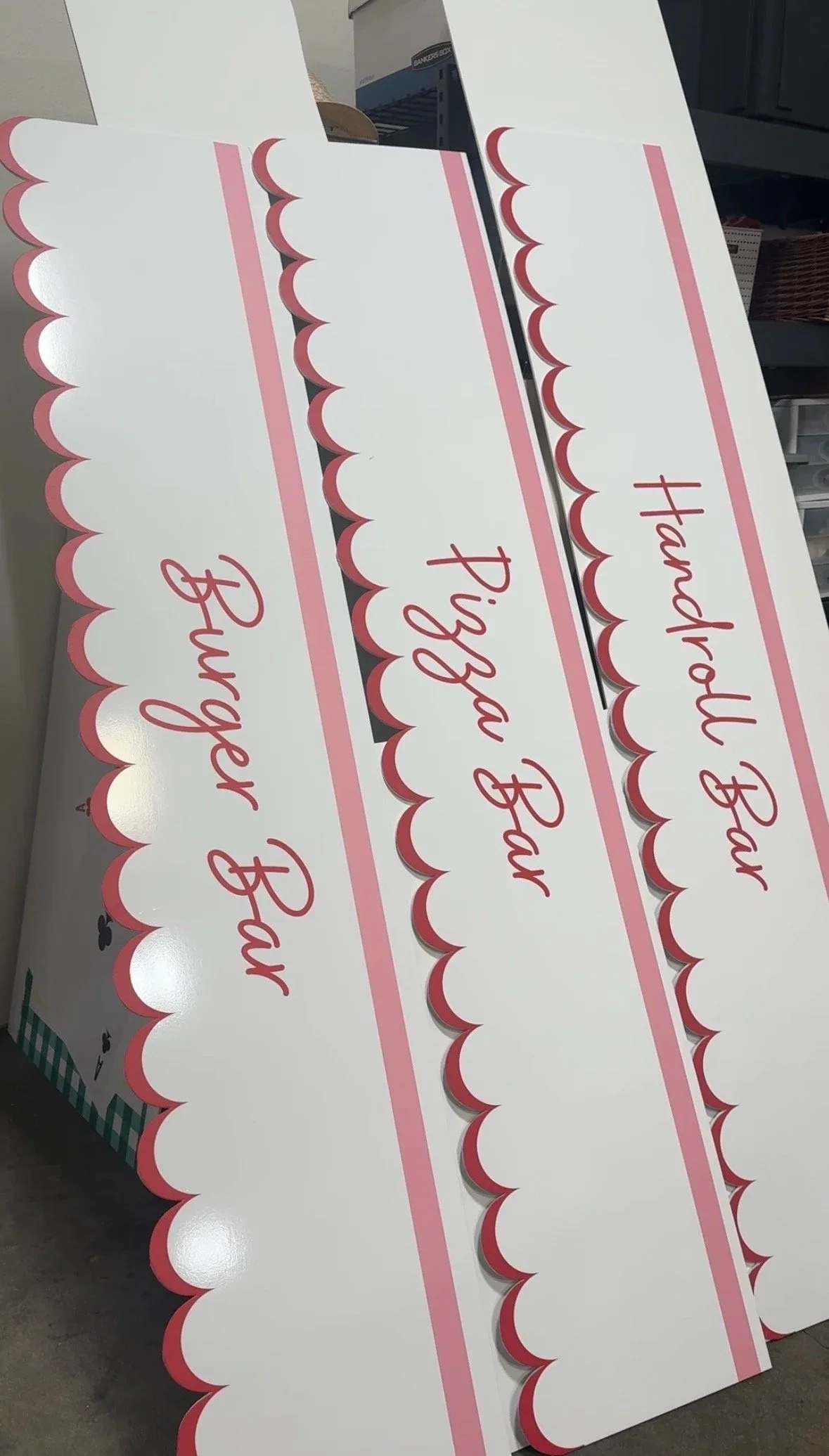 Scalloped burger, pizza and handroll bar signs
